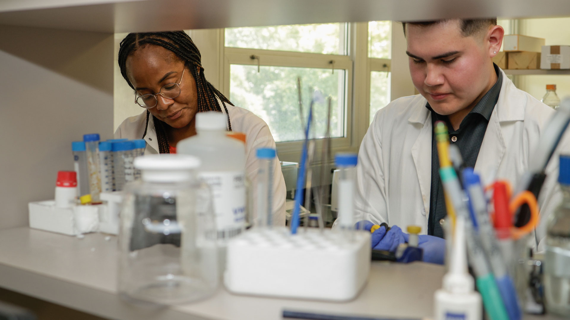 FSC Student working with professor In biology lab